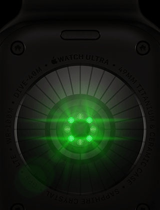 Rückseite der Apple Watch Ultra 4, Titangehäuse, Farbe Schwarz, mehrere runde Sensoren mit grün leuchtenden LEDs